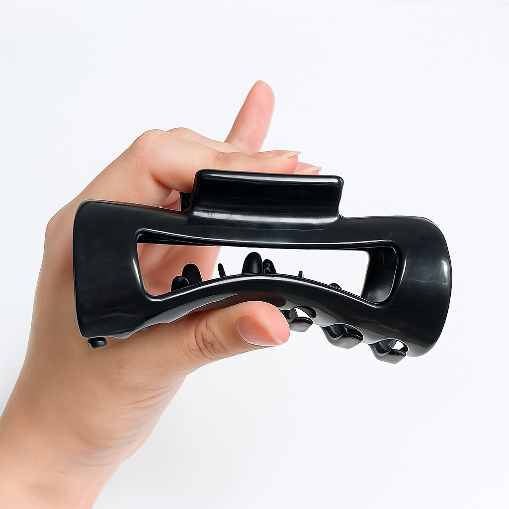 Black cloud clip held in hand